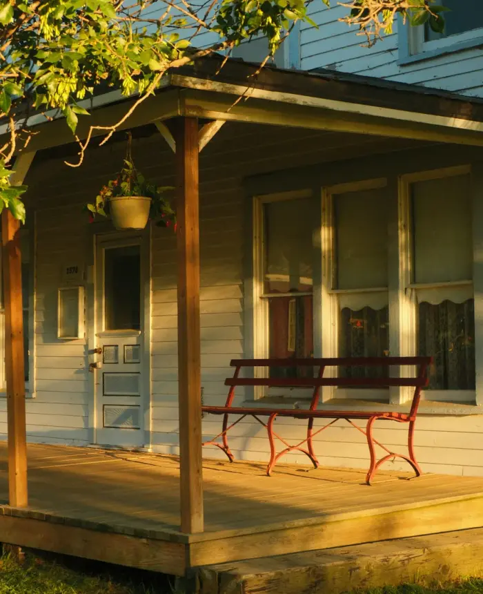 A sunlit front porch of a welcoming family home